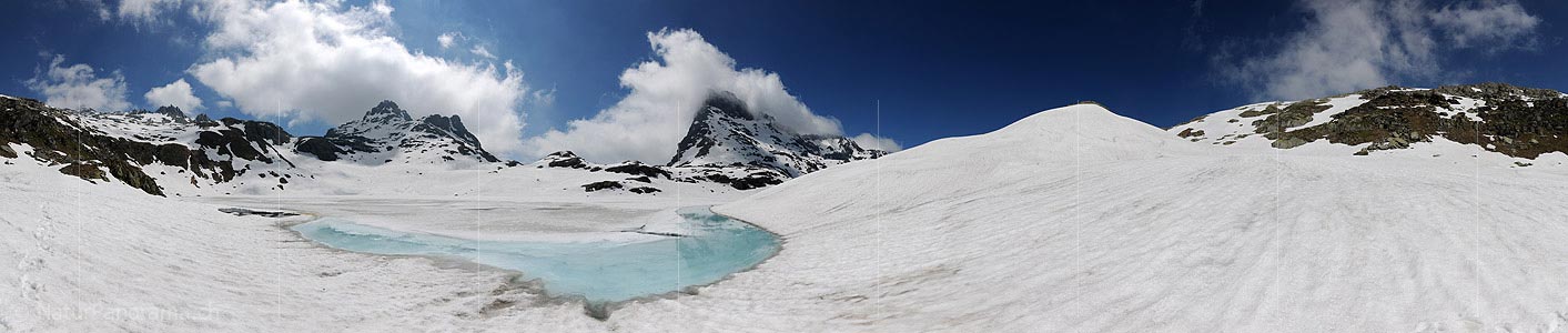 P009903: 360° panoramic image Light blue water on a partially frozen lake