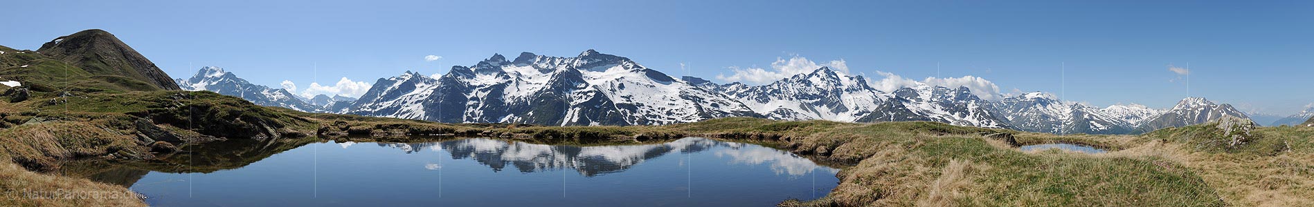 P010099a: Panoramic photo reflection of mountain landscape in small mountain lake