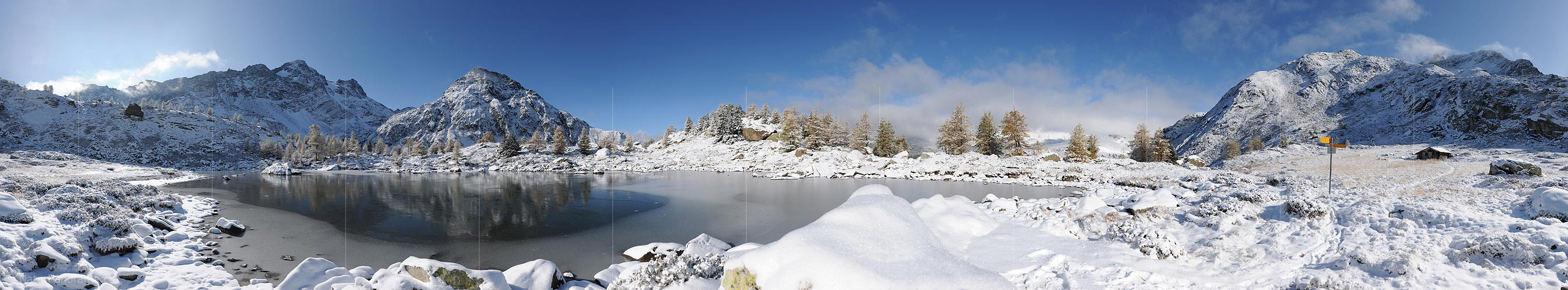P005774: Big panorama picture of black ice on mountain lake