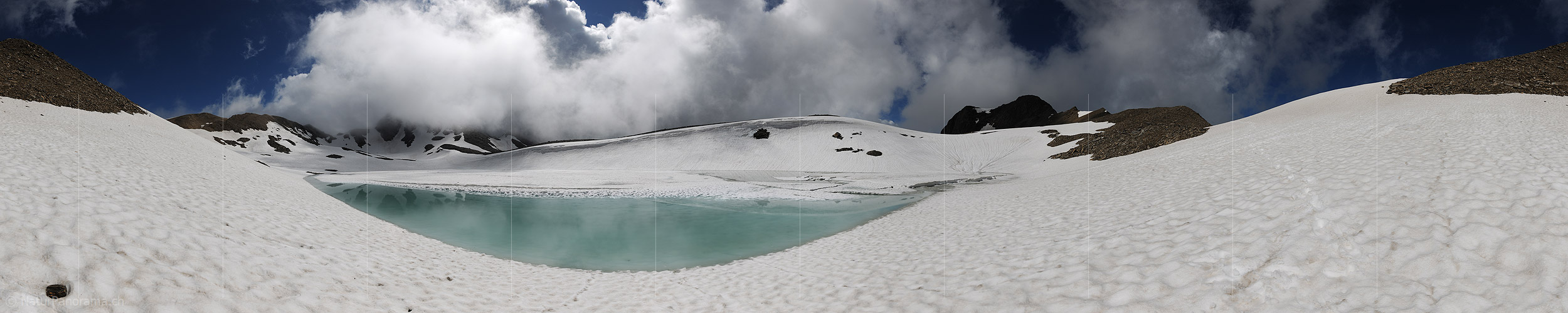 P010053: 360° Panorama view Turquoise waters in part on frozen mountain lake