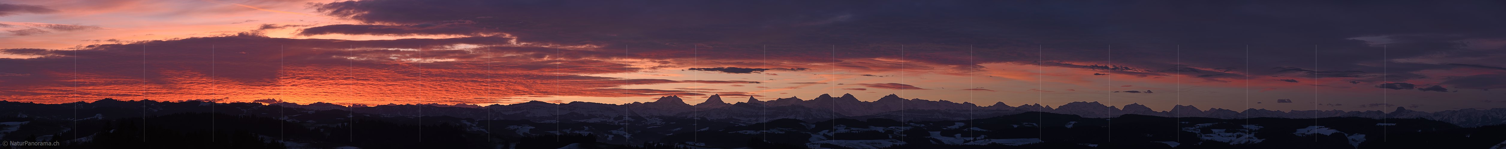 P017394a: Panorama photo Early morning with with glowing clouds over the Alps