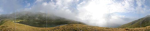 Panoramic picture morning fog in mountain lake (Jostsee)