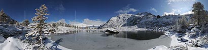 Big panorama picture of an ice covered mountain lake