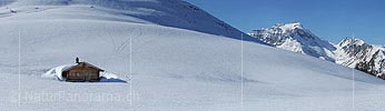 Panoramic photo Alpine hut in winter landscape