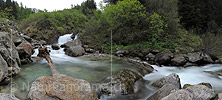 Panoramic photo Small waterfall in mountain stream