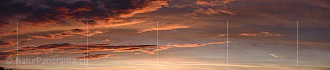 Panoramafoto Glowing clouds in the morning sky