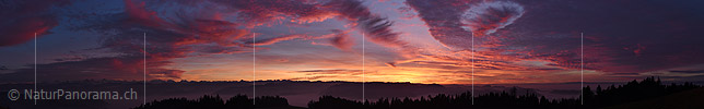 Panorama Artfully formed glowing clouds in the evening sky