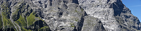 Panoramam photo Light and shadow in the rock faces at the ostegg (Eiger)